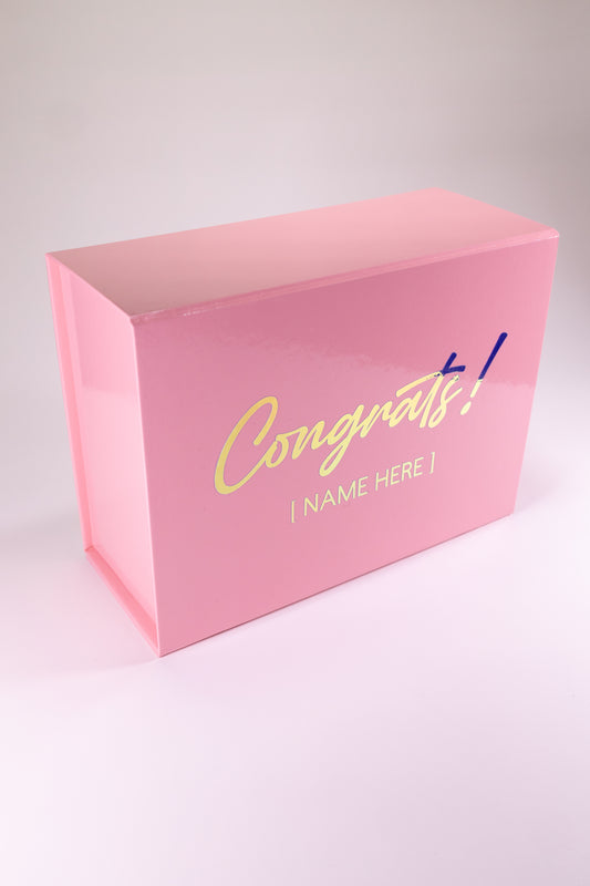 Pink gift box with 'Congrats!' text on a white background