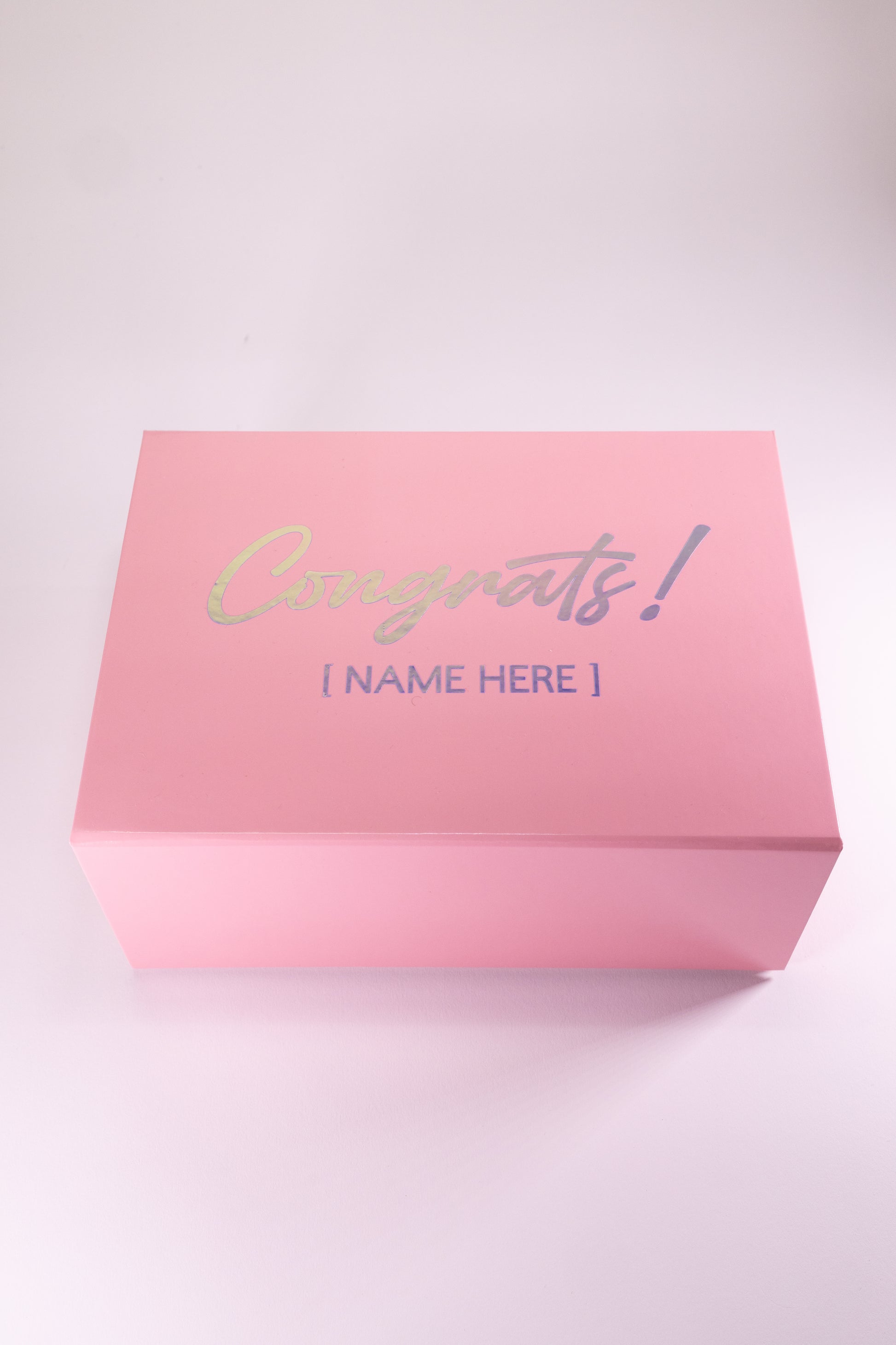 Pink gift box with 'Congrats!' and a name placeholder on a white background