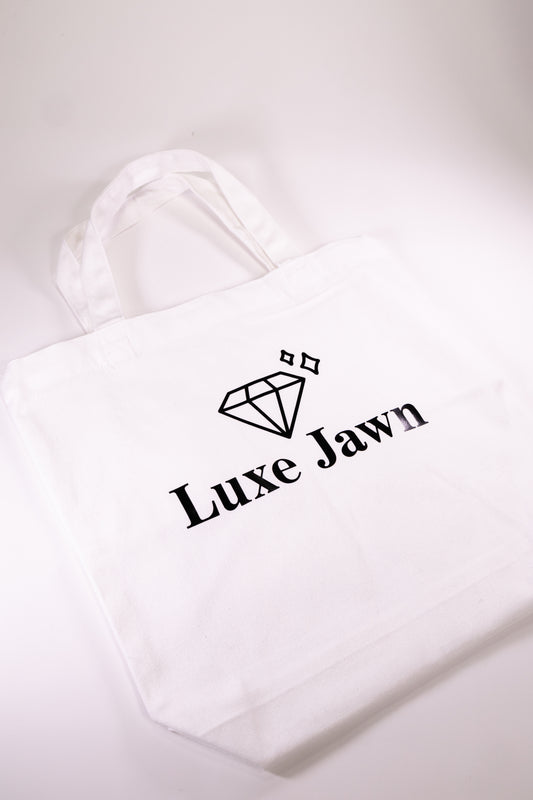 White Canvas Tote with words Luxe Jawn