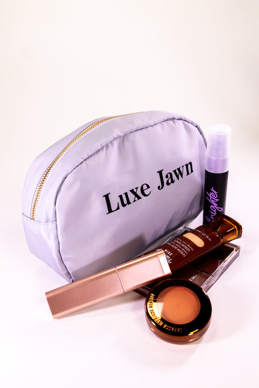 Makeup bag with the words Luxe Jawn